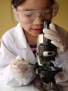 Student Using a Microscope